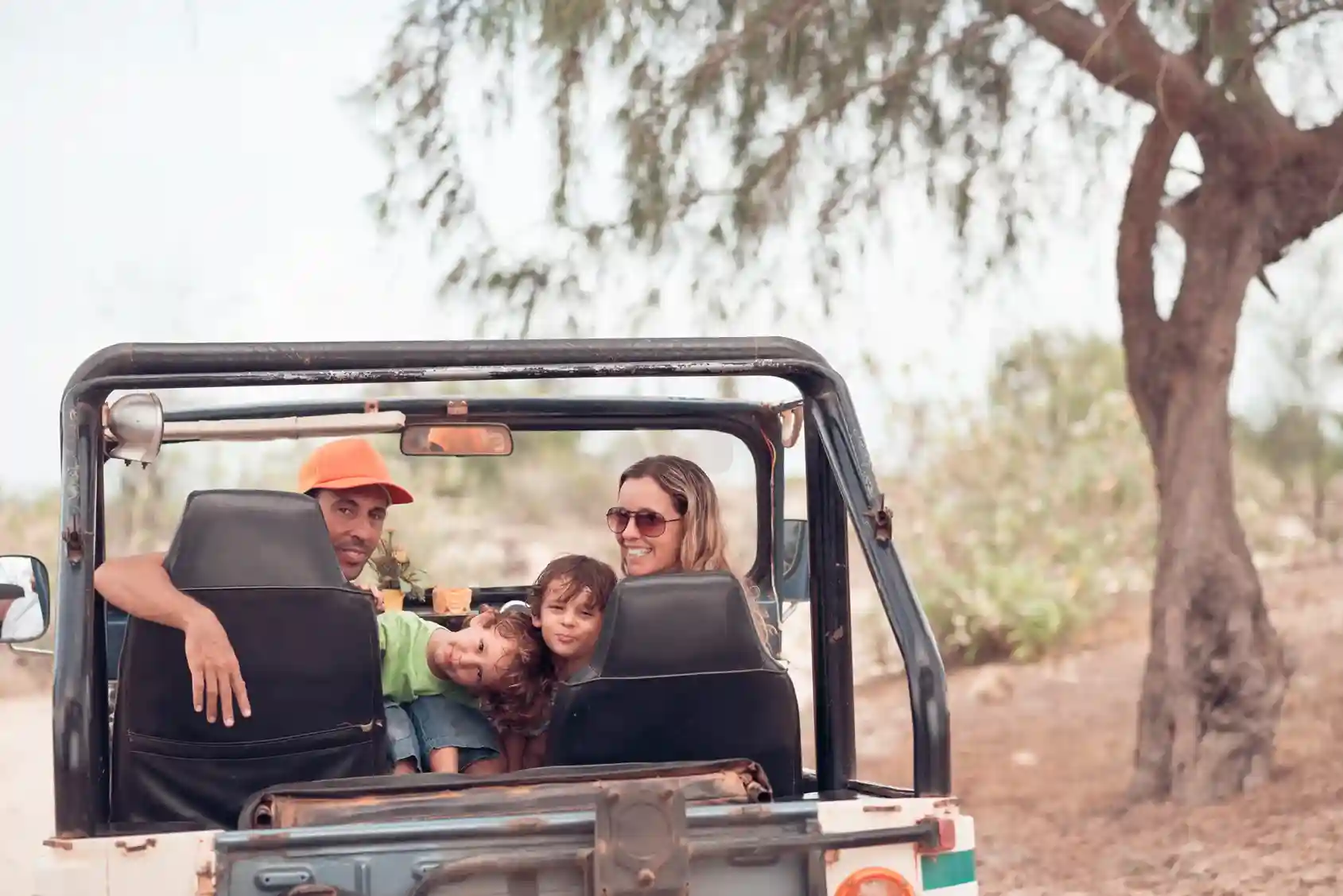 Family enjoying an off-road trip in a Jeep with SUMMIT 4X4 COMPANY