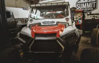 Custom off-road vehicle in the Summit 4x4 workshop showcasing modifications and upgrades