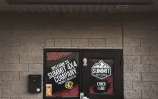 Front entrance of Summit 4x4 Company in Prescott Arizona with logo and signage