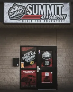 Alt Text: Summit 4x4 Company storefront entrance in Prescott Valley with logo and signage