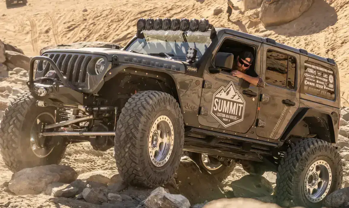 Summit 4x4 custom Jeep Rubicon climbing rocky terrain in Prescott Arizona