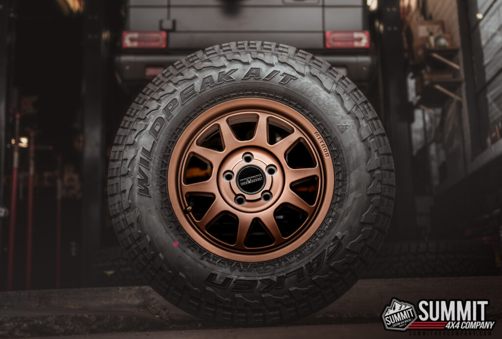 Falken Wildpeak A/T tire with bronze off-road wheel at Summit 4x4 Company
